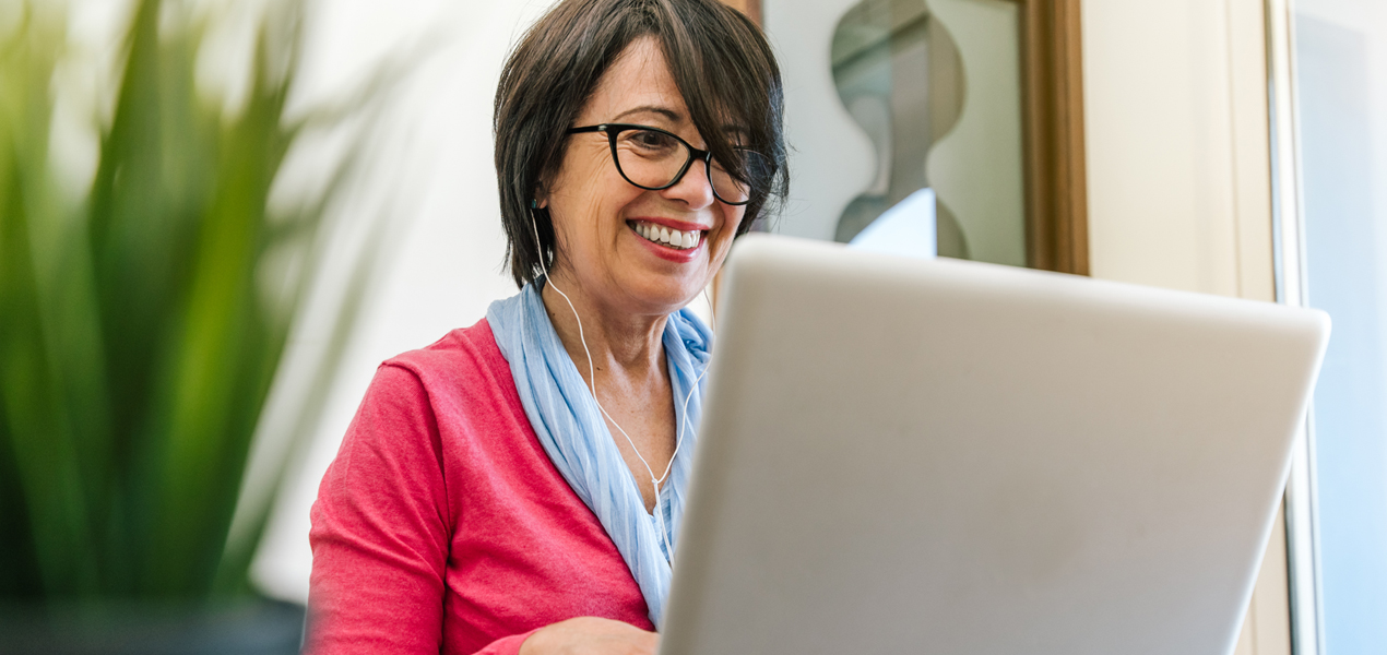 Mature woman working on laptop.